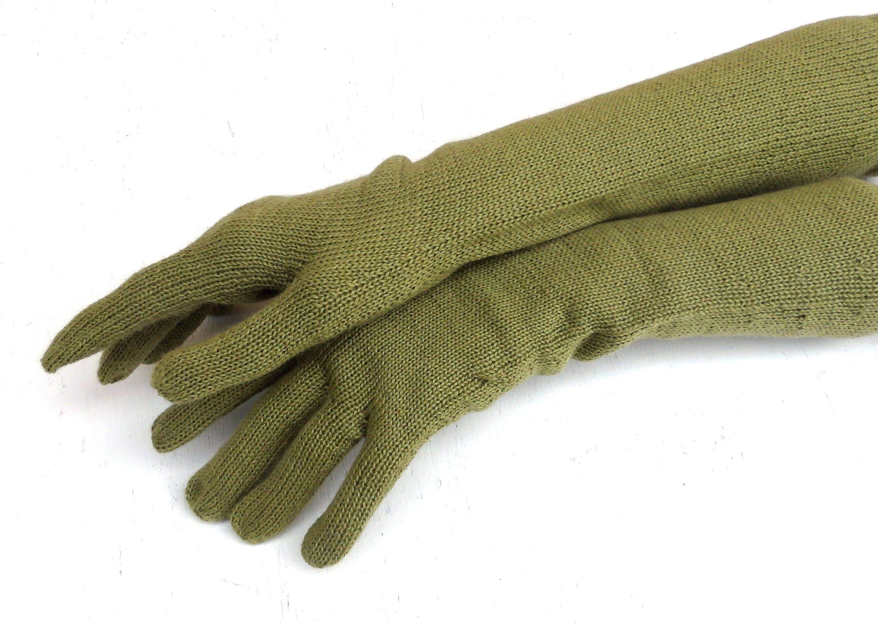 Pair of green gloves on a white background