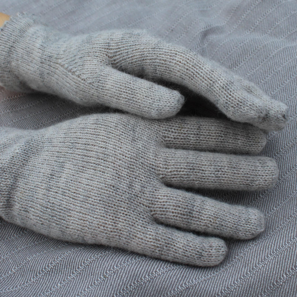 Gray gloves on a textured gray surface