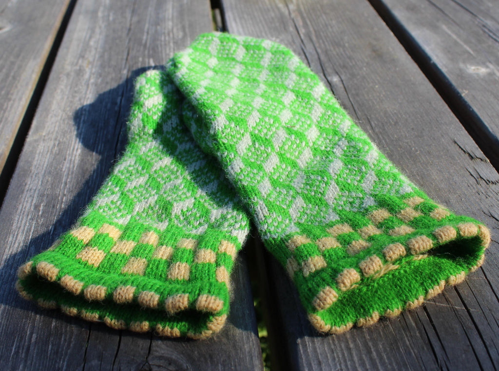 Green and white checkered fabric on a wooden surface