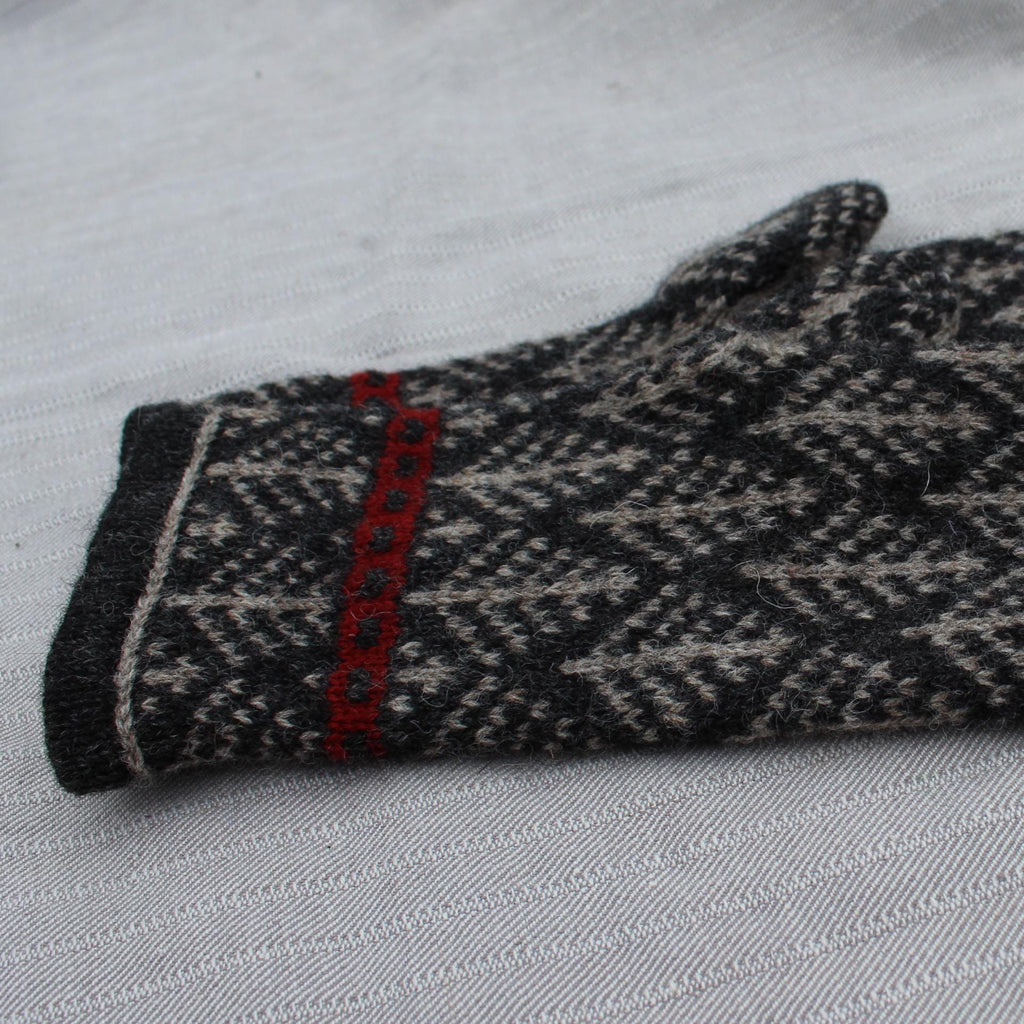 Knitted glove with a pattern on a white background