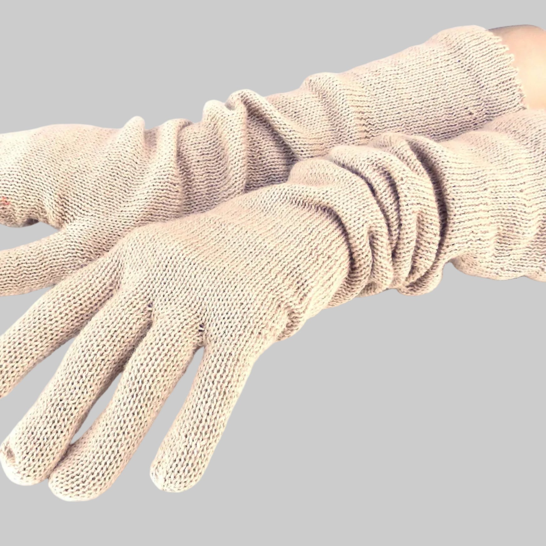 Pair of beige gloves on a white background