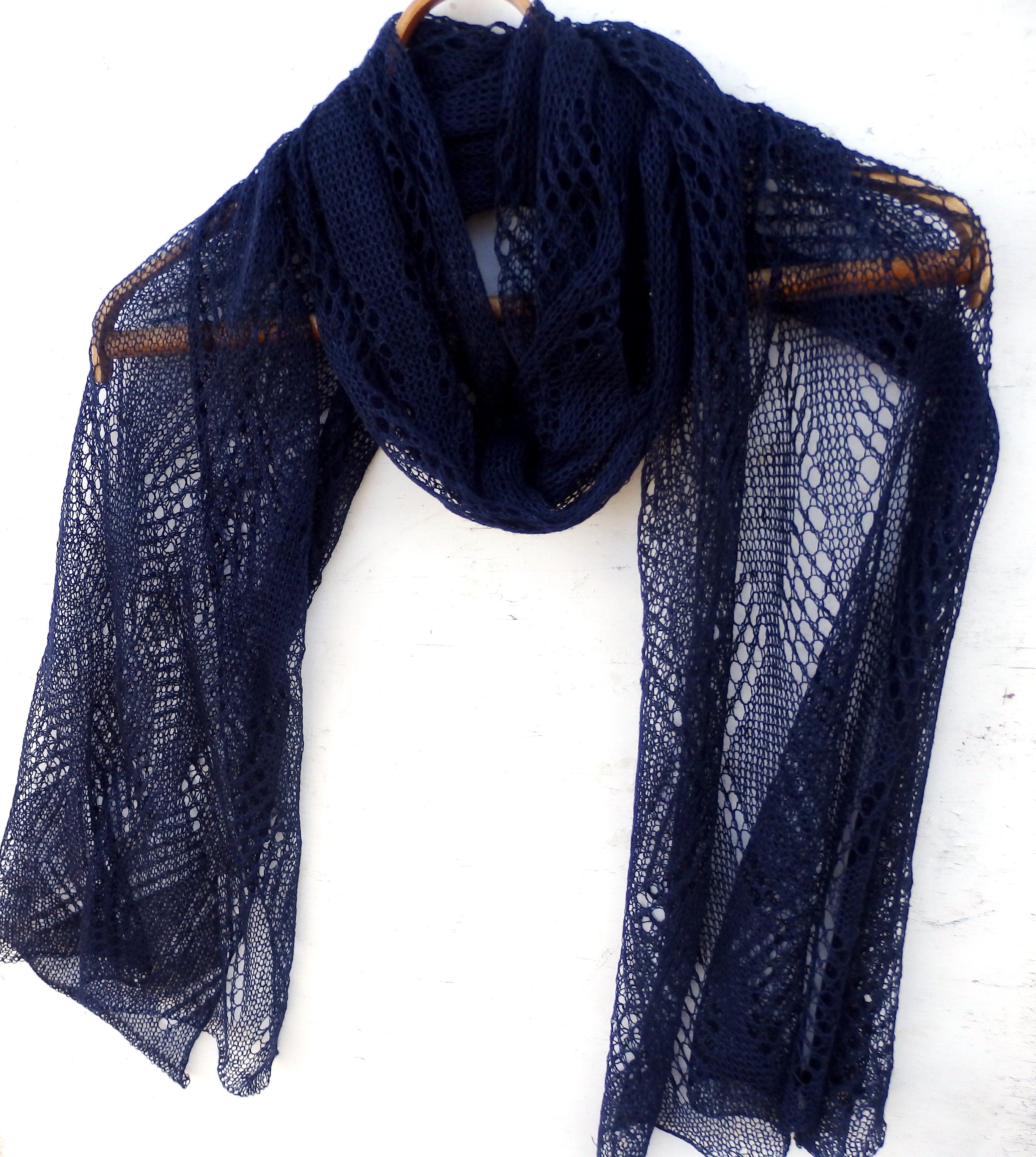 Navy blue lace scarf on a white background