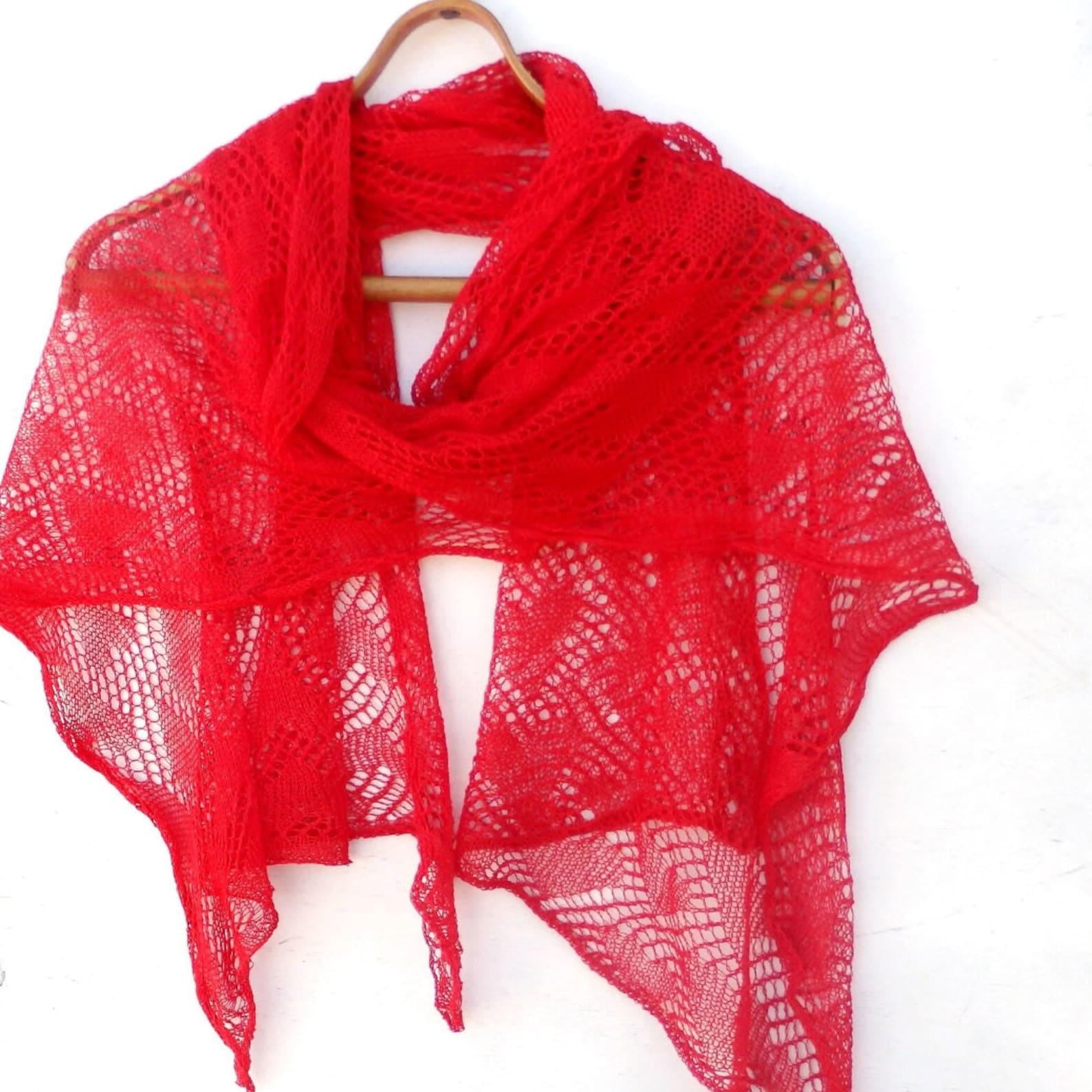 Red knitted shawl on a white background