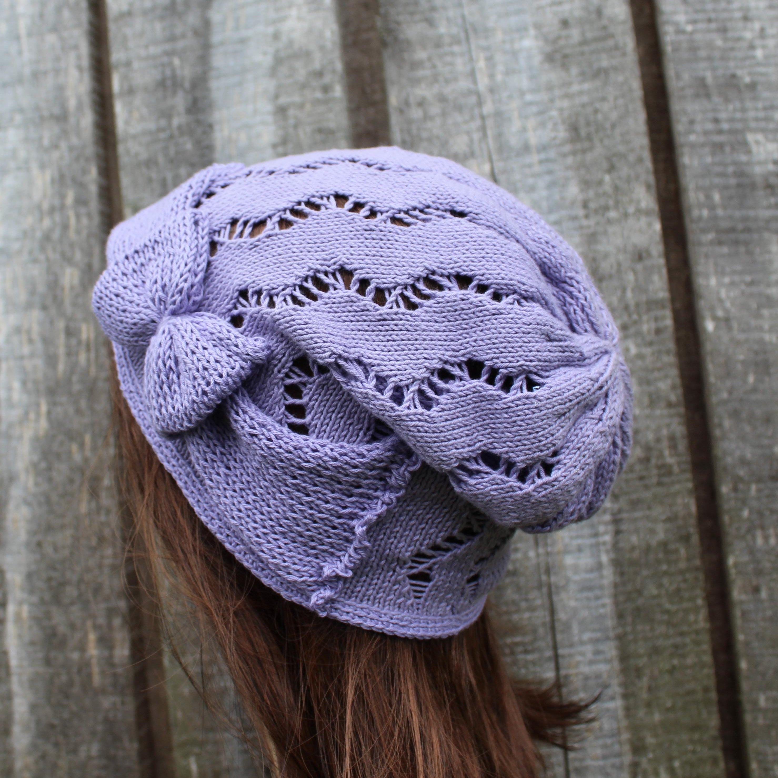 Purple knitted headscarf on a person with wooden background