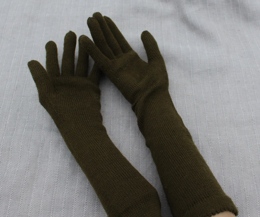 Pair of brown gloves on a light gray background
