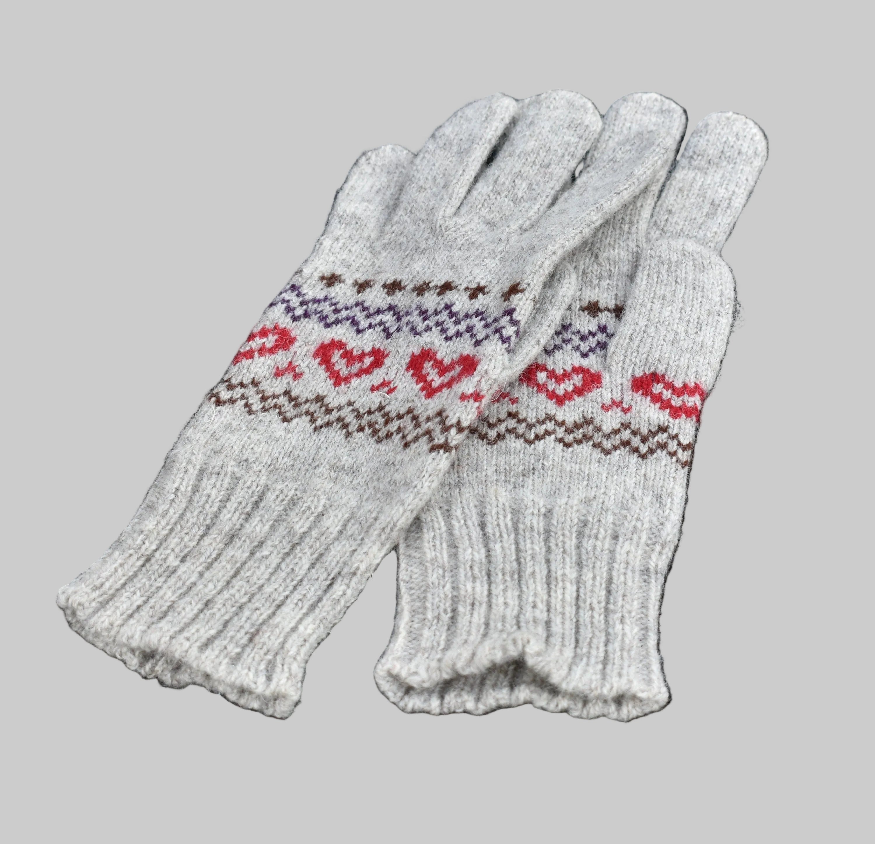 Pair of gray gloves with heart pattern on a black background