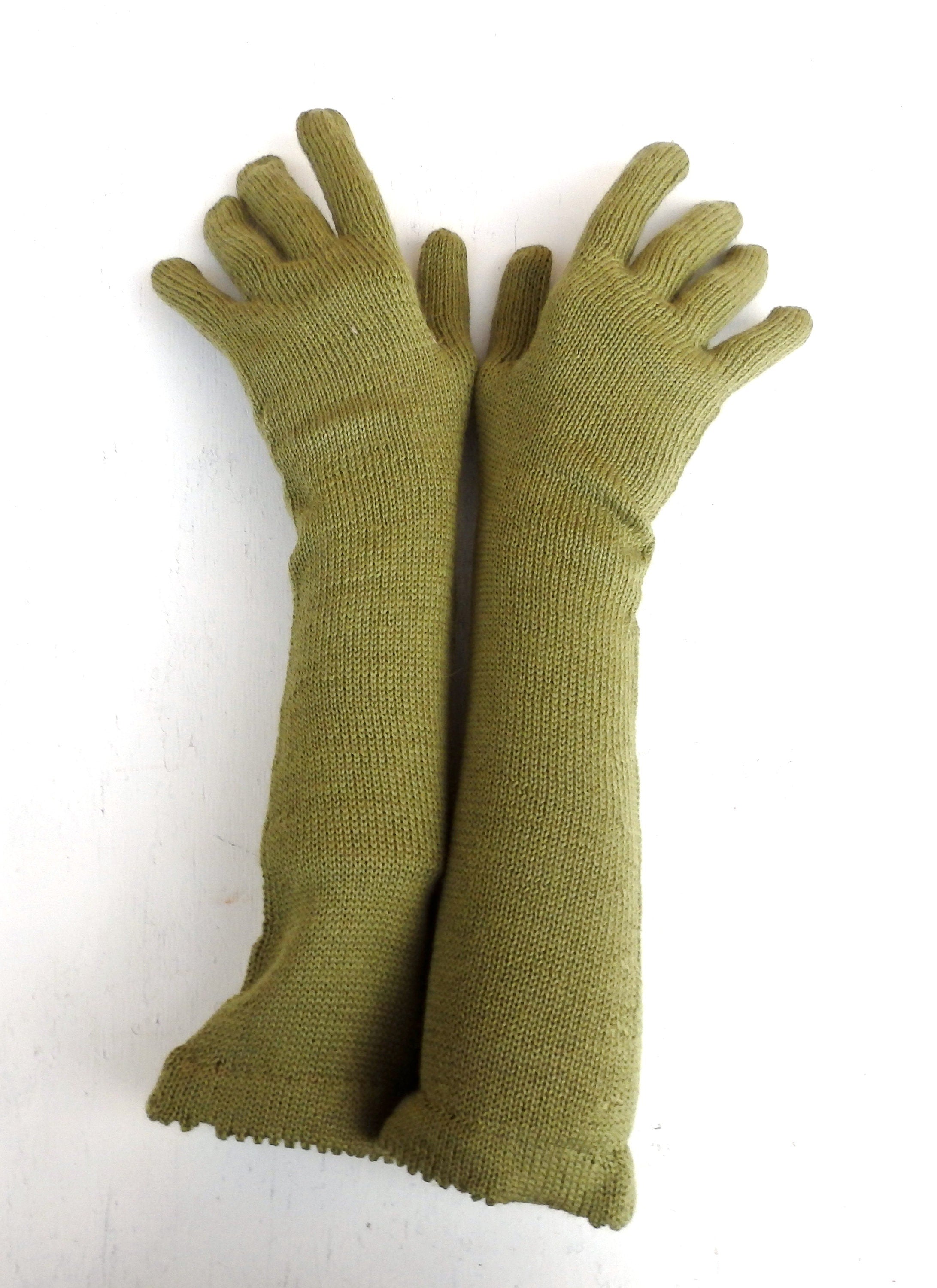 Pair of green gloves on a white background