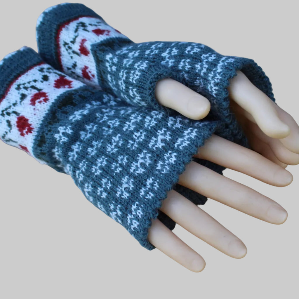 Knitted fingerless gloves with a pattern on a wooden surface