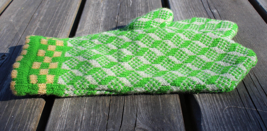 Green and white checkered oven mitt on a wooden surface