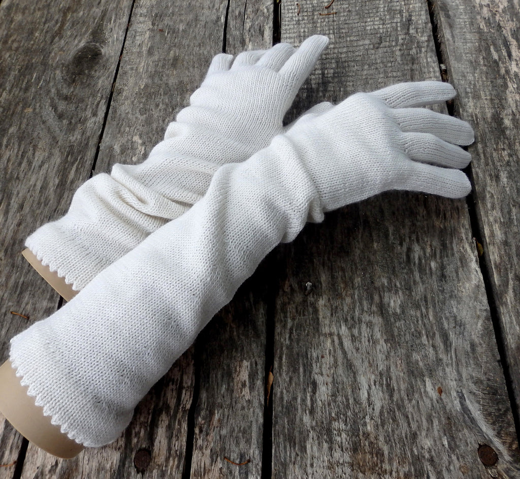 White gloves on a wooden surface
