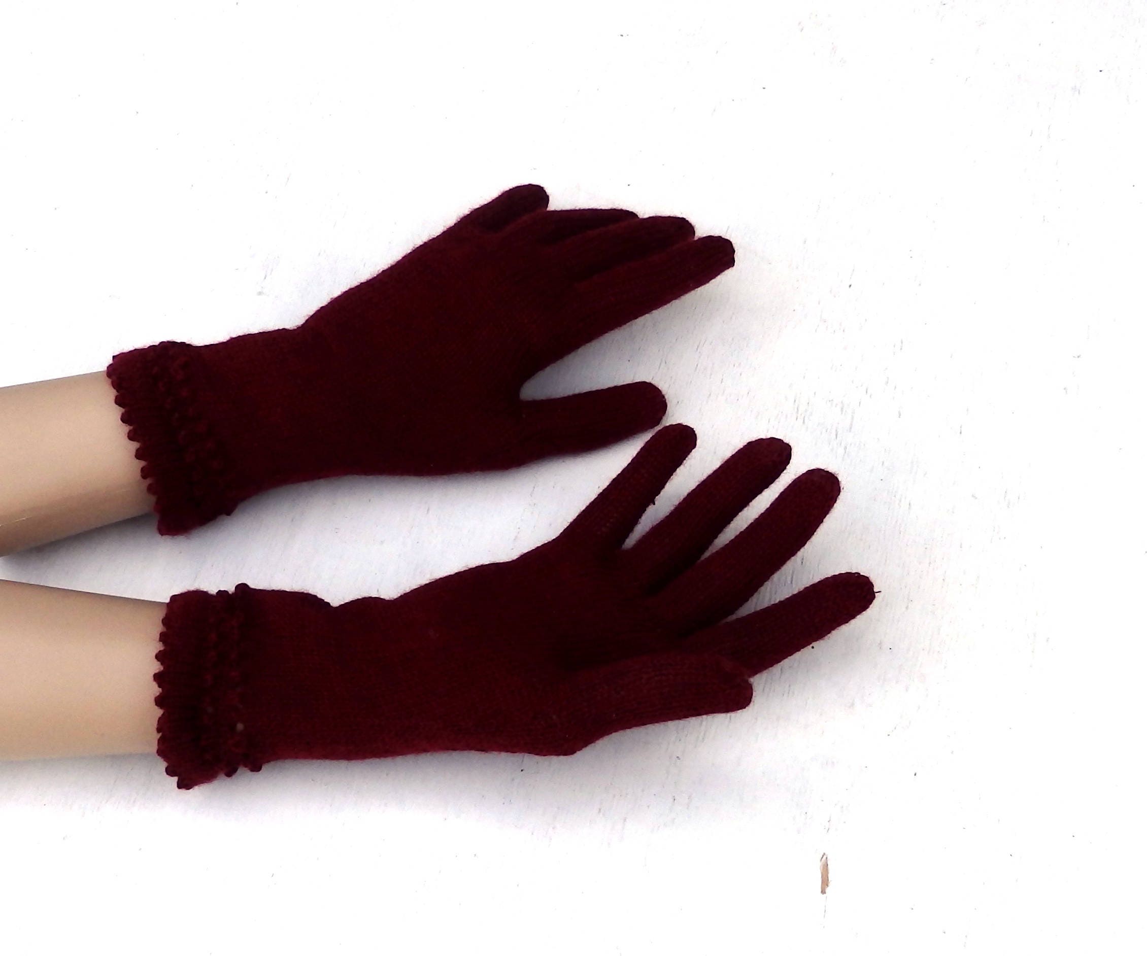 Pair of dark red gloves on a white background