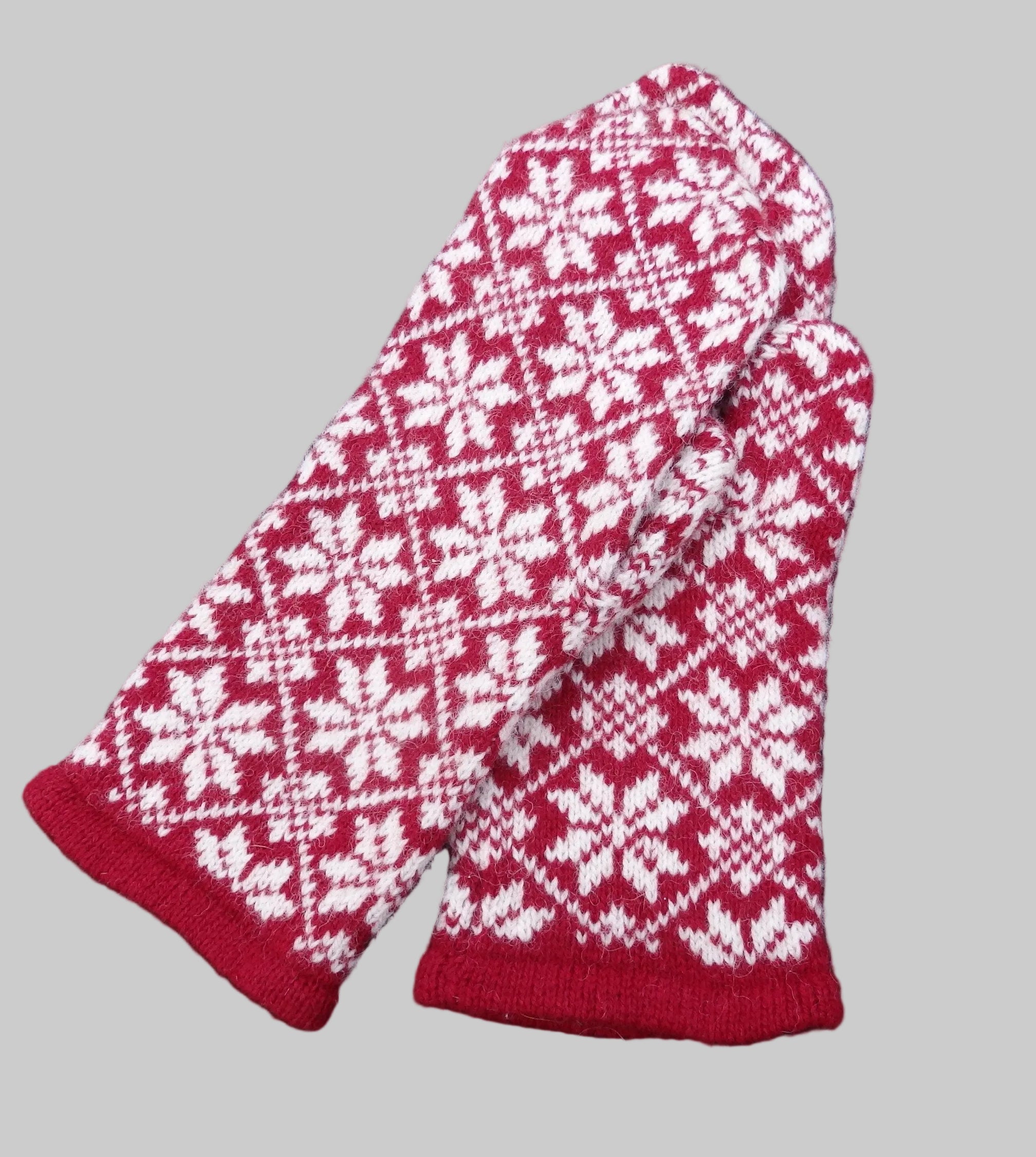 Red and white patterned mittens 