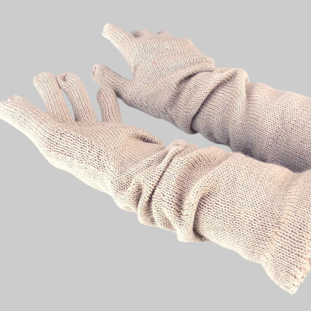 Pair of beige gloves on a white background