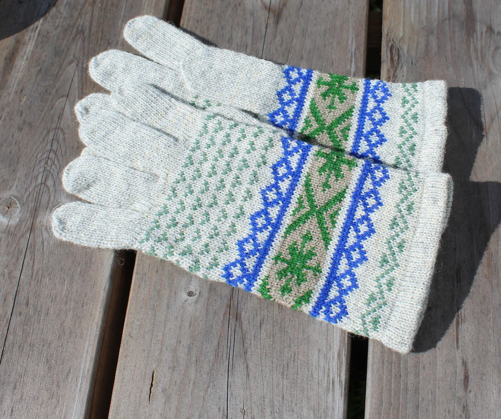 Pair of gloves with a pattern on a wooden surface