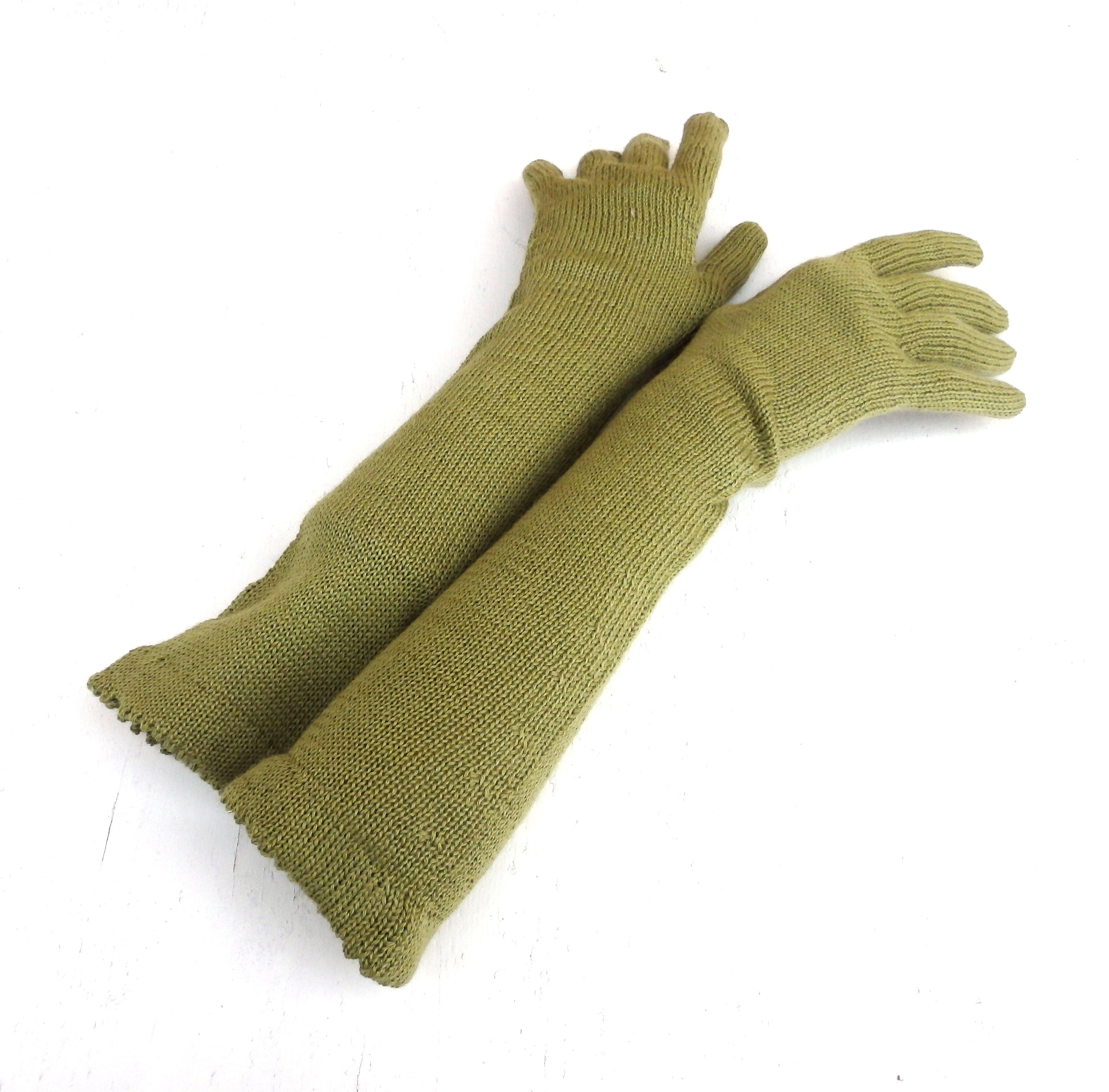Pair of green knitted gloves on a white background