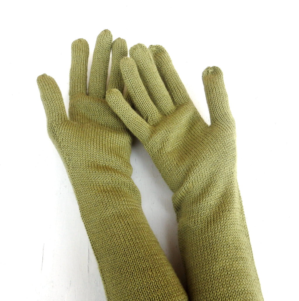 Pair of green gloves on a white background
