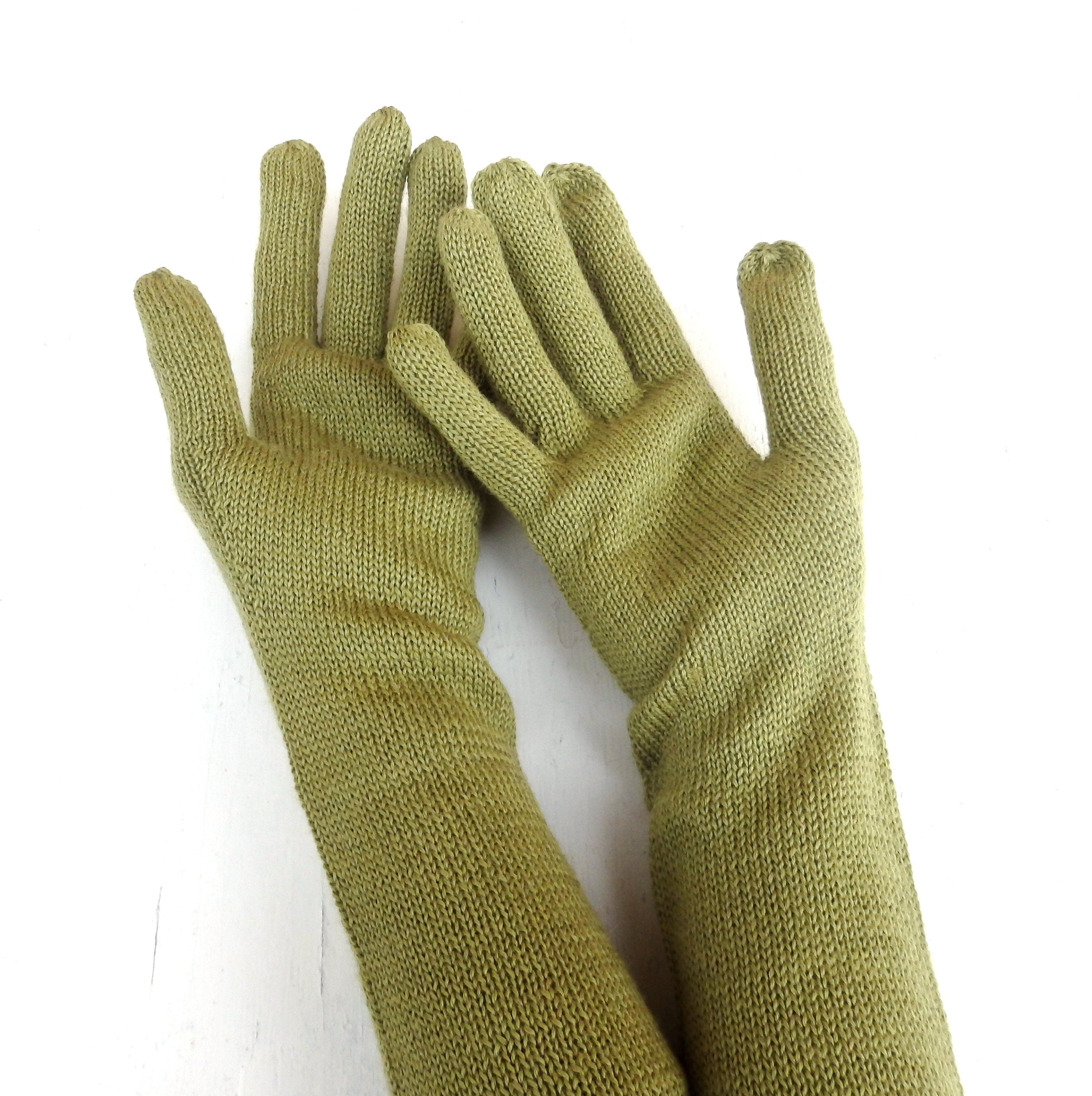 Pair of green gloves on a white background