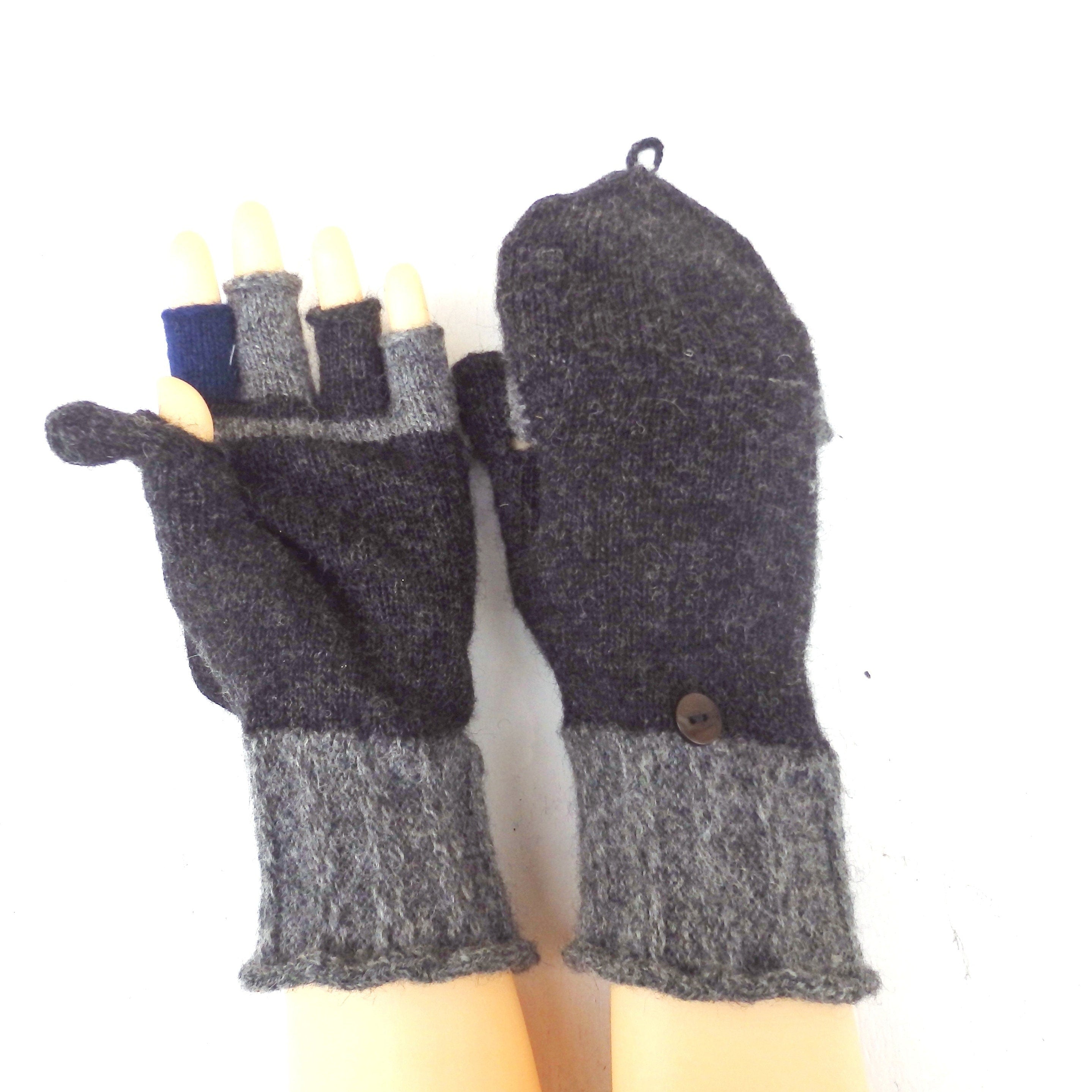 Pair of gray mittens with a button on a white background