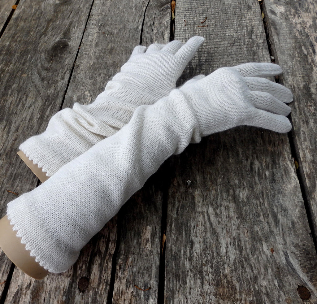 White gloves on a wooden surface