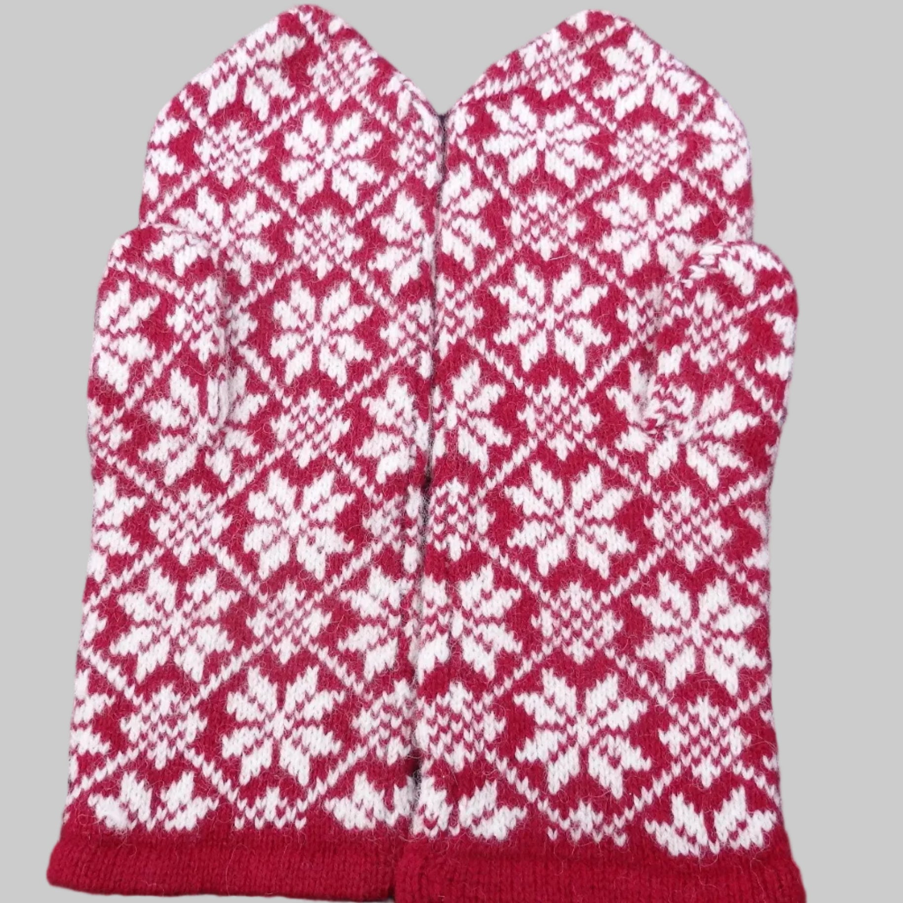 Red and white patterned mittens 