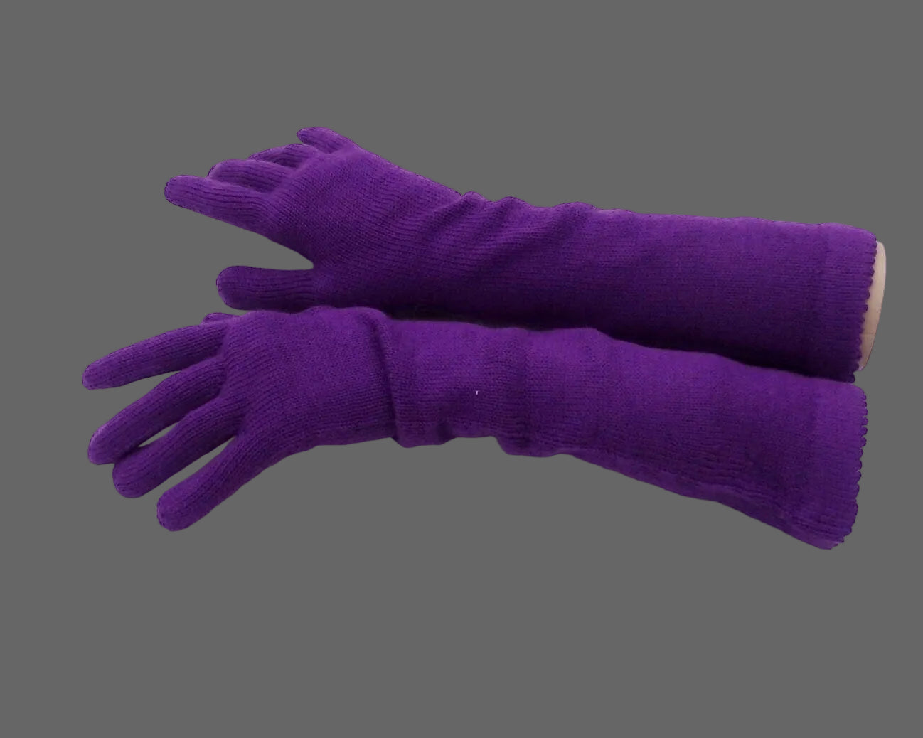 Pair of purple gloves on a white background