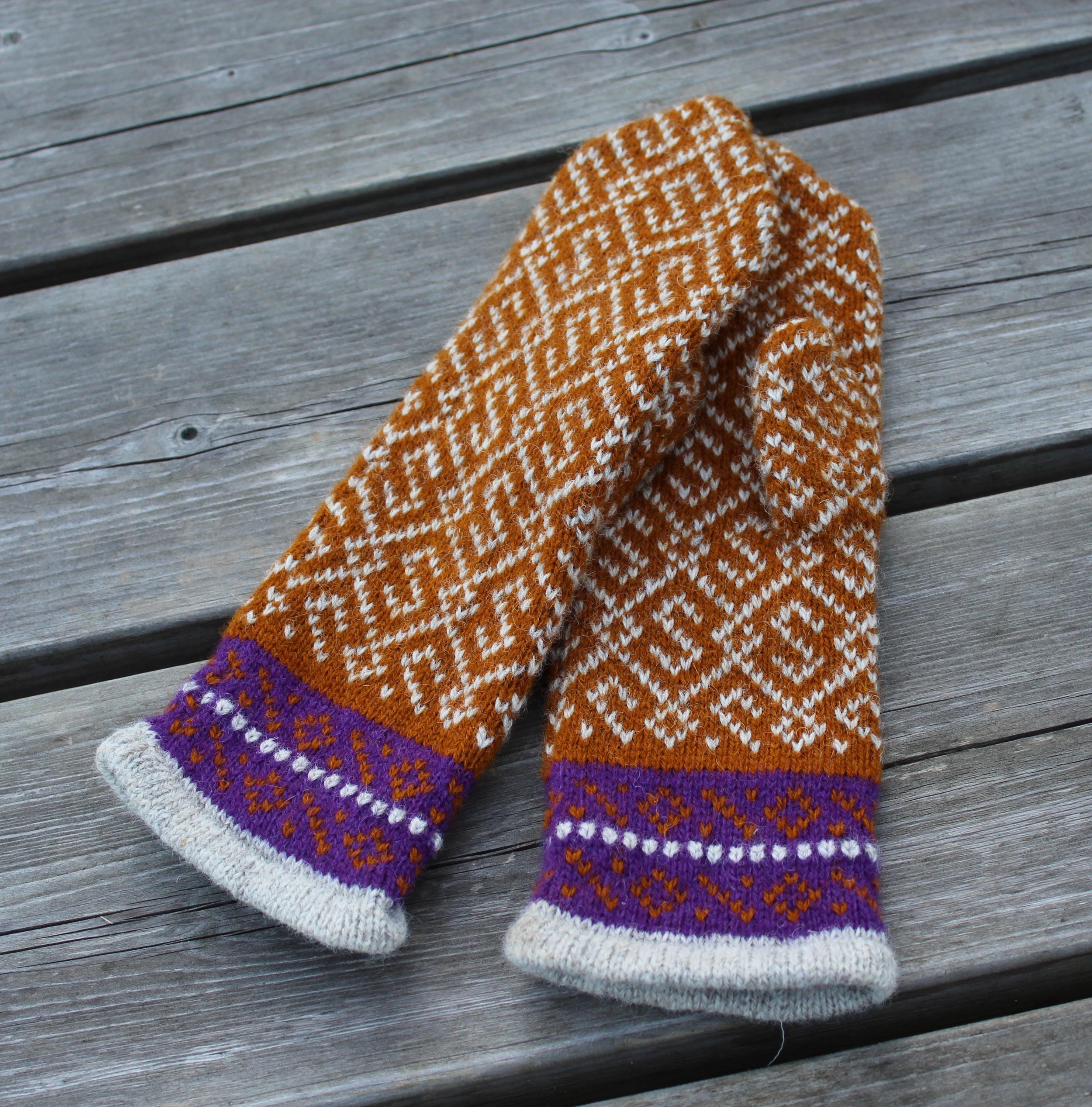 Knitted scarf with geometric pattern on a wooden surface