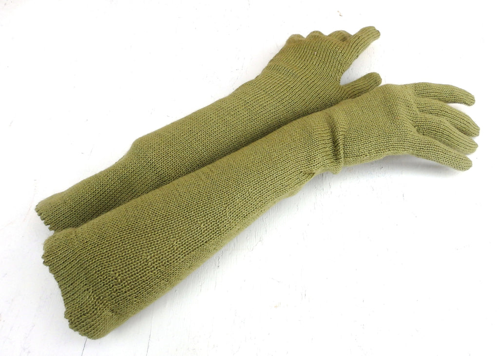 Pair of green knitted gloves on a white background