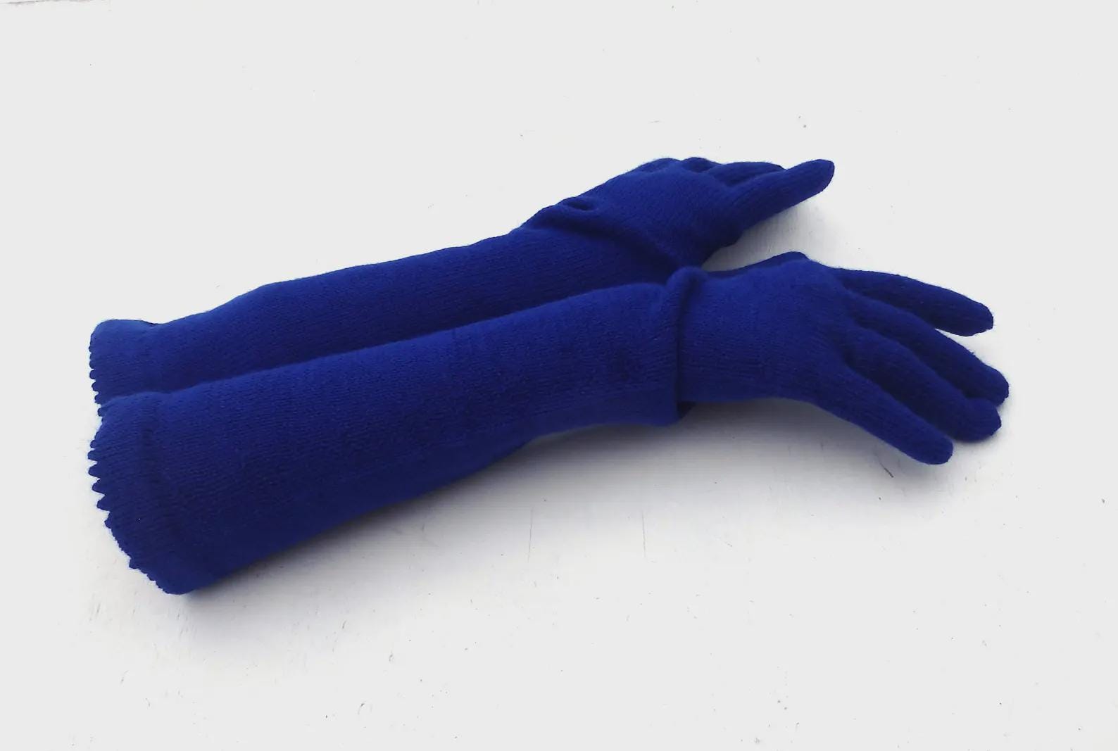 Pair of blue gloves on a white background