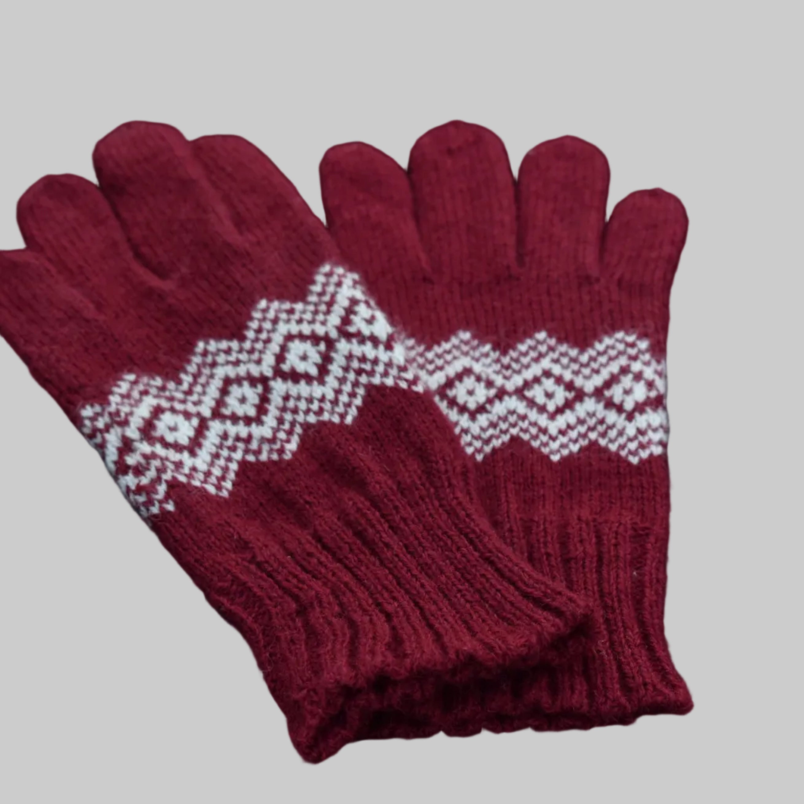 Pair of red gloves with white pattern on a black background