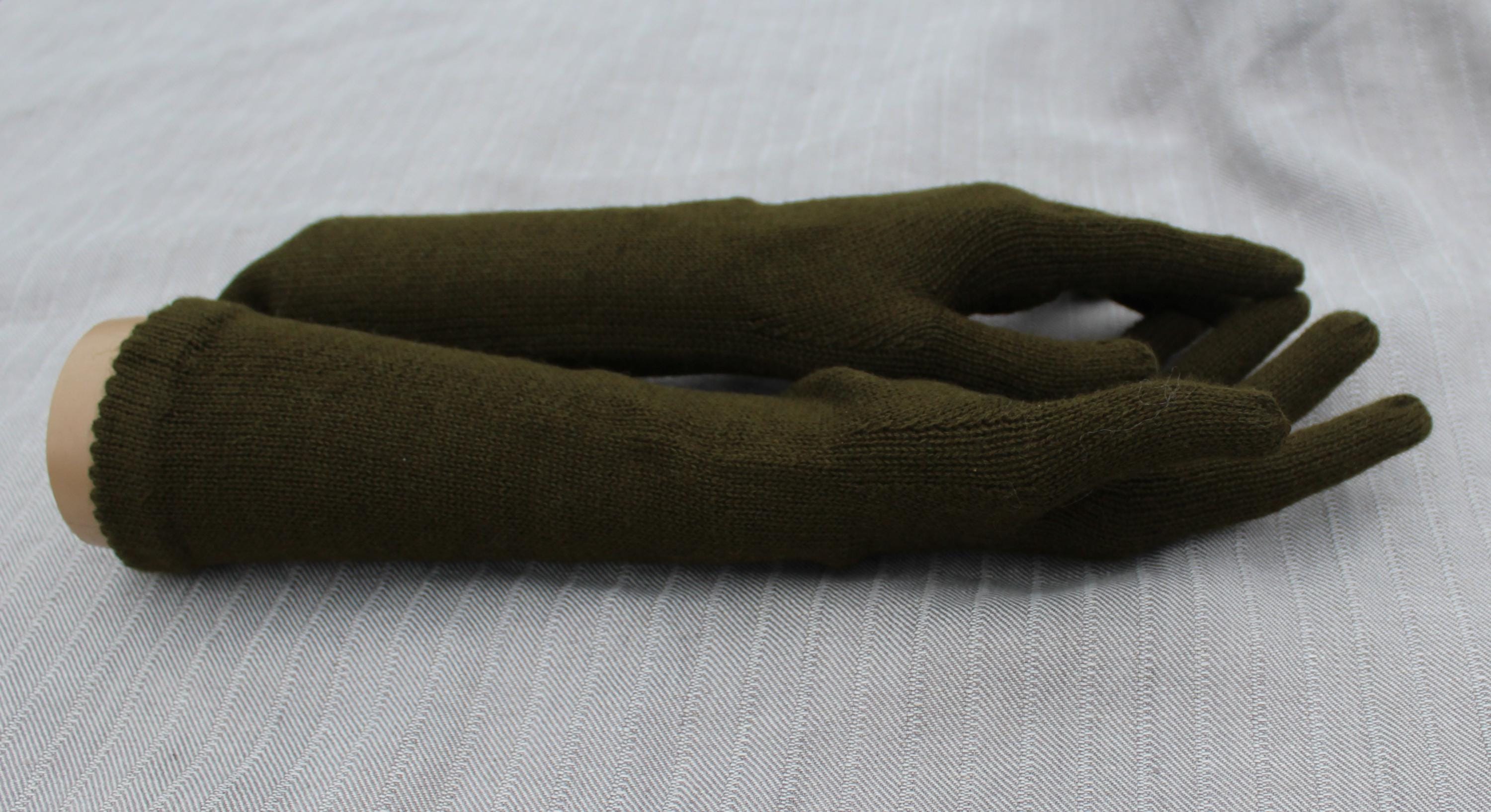 Brown gloves on a light gray background