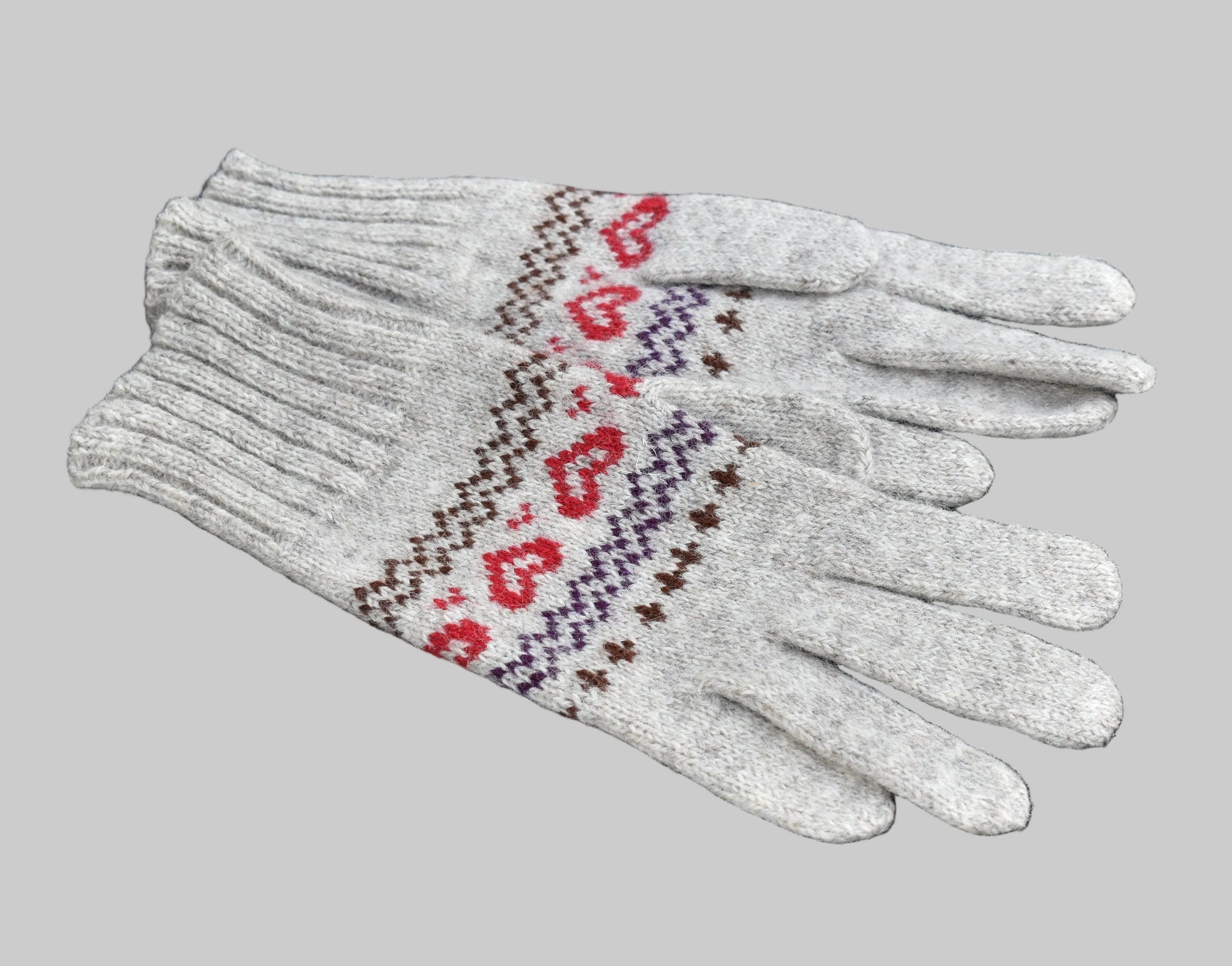 White gloves with red heart pattern on a black background