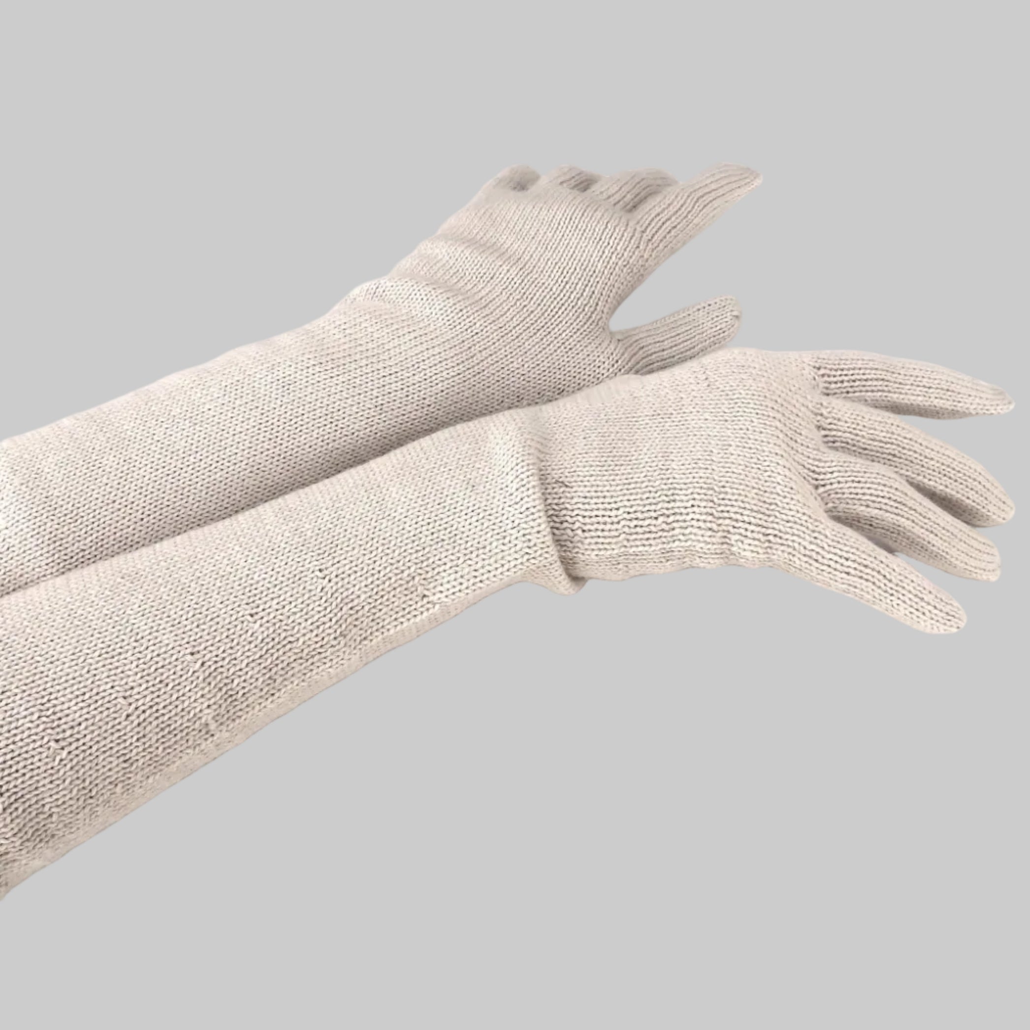 Pair of beige gloves on a white background