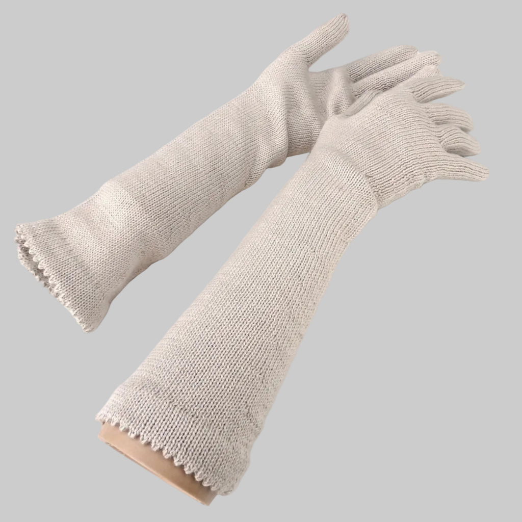 Pair of beige gloves on a white background