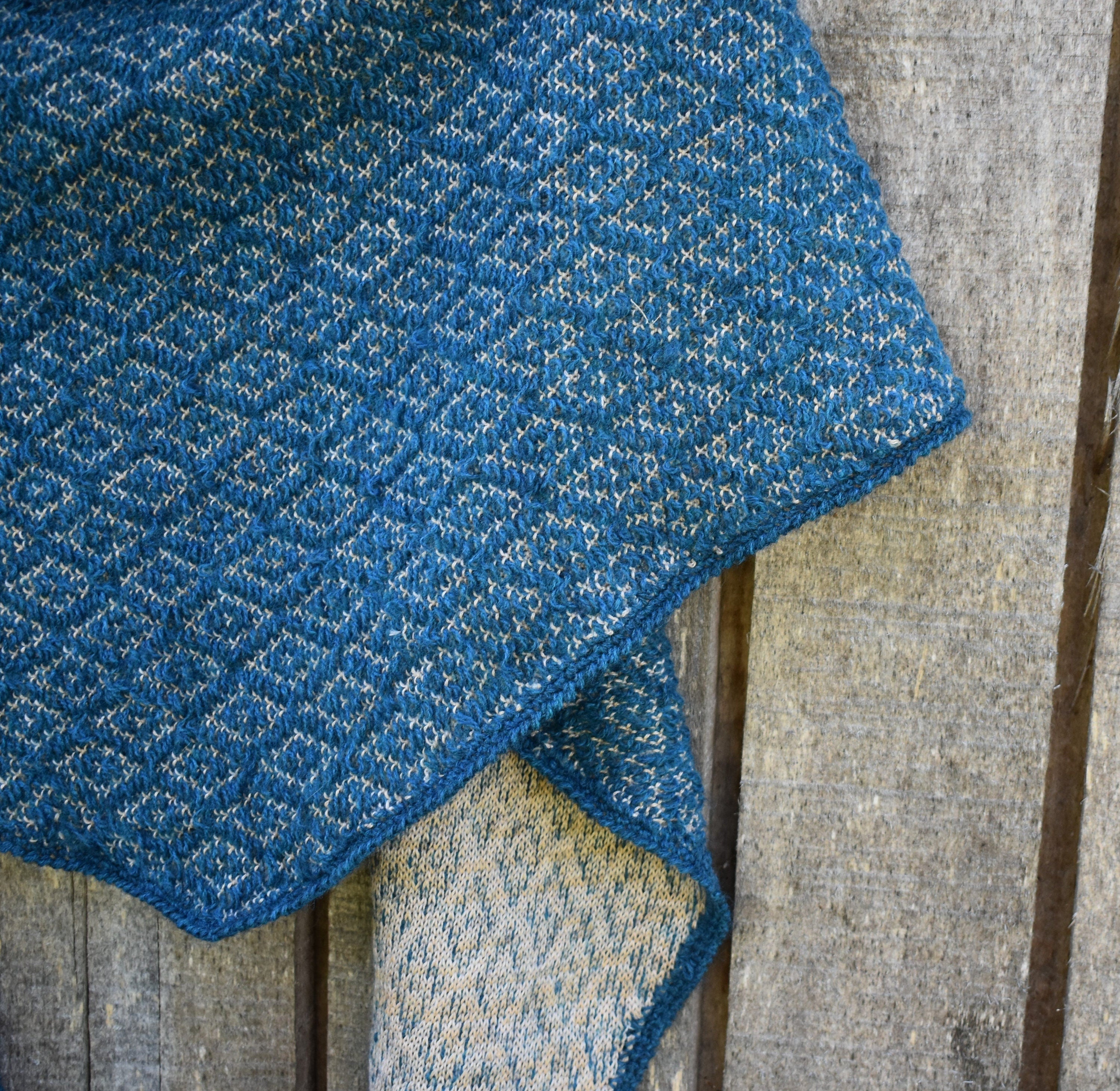 Blue textured fabric on a wooden surface