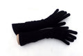 Pair of black gloves on a white background