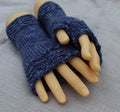 Blue knitted fingerless gloves on a mannequin hand against a gray background