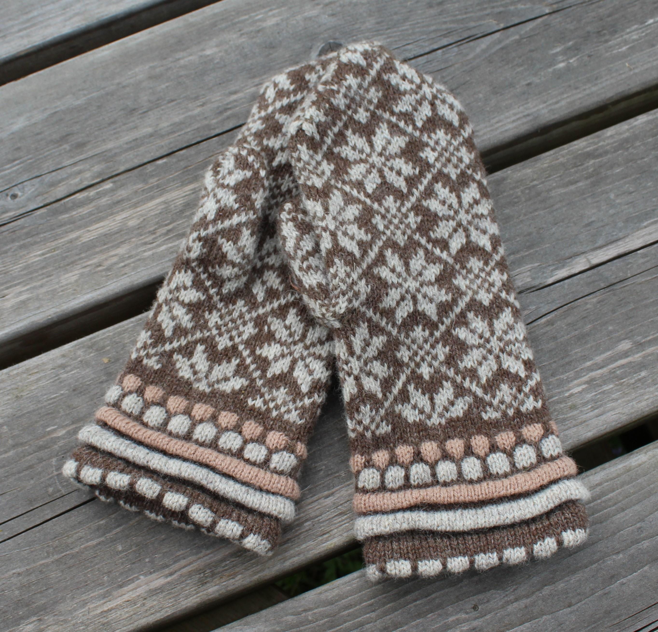 Knitted scarf with a pattern on a wooden surface