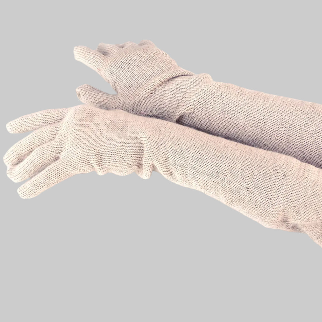 Pair of beige gloves on a white background