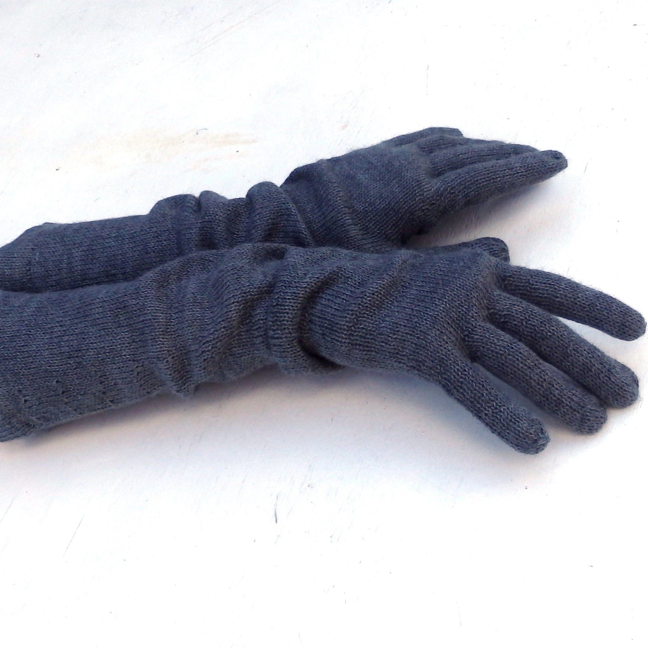 Pair of blue gloves on a white background