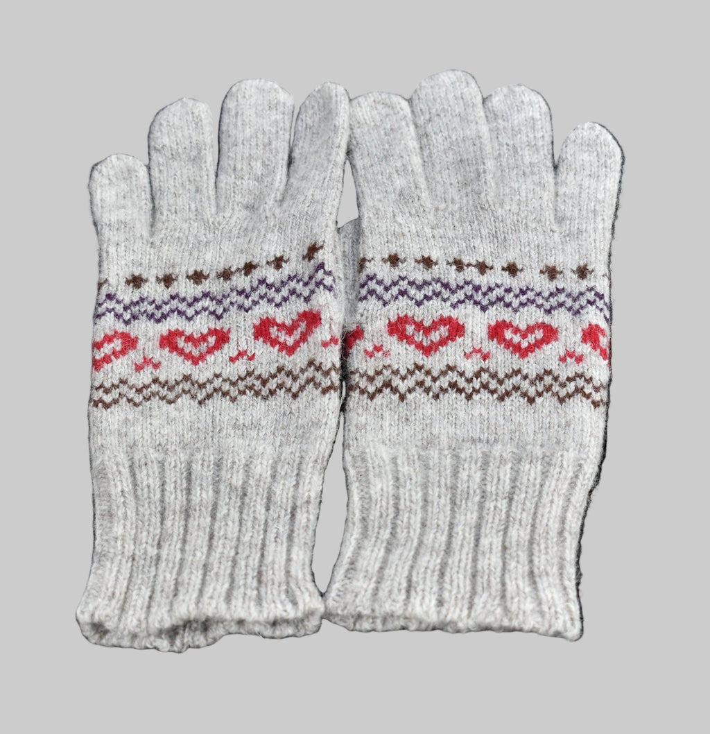 Pair of gray gloves with heart pattern on a black background