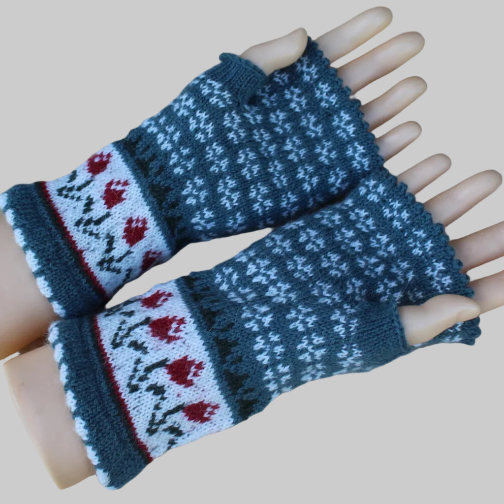Pair of knitted fingerless gloves with a floral pattern on a mannequin hand.