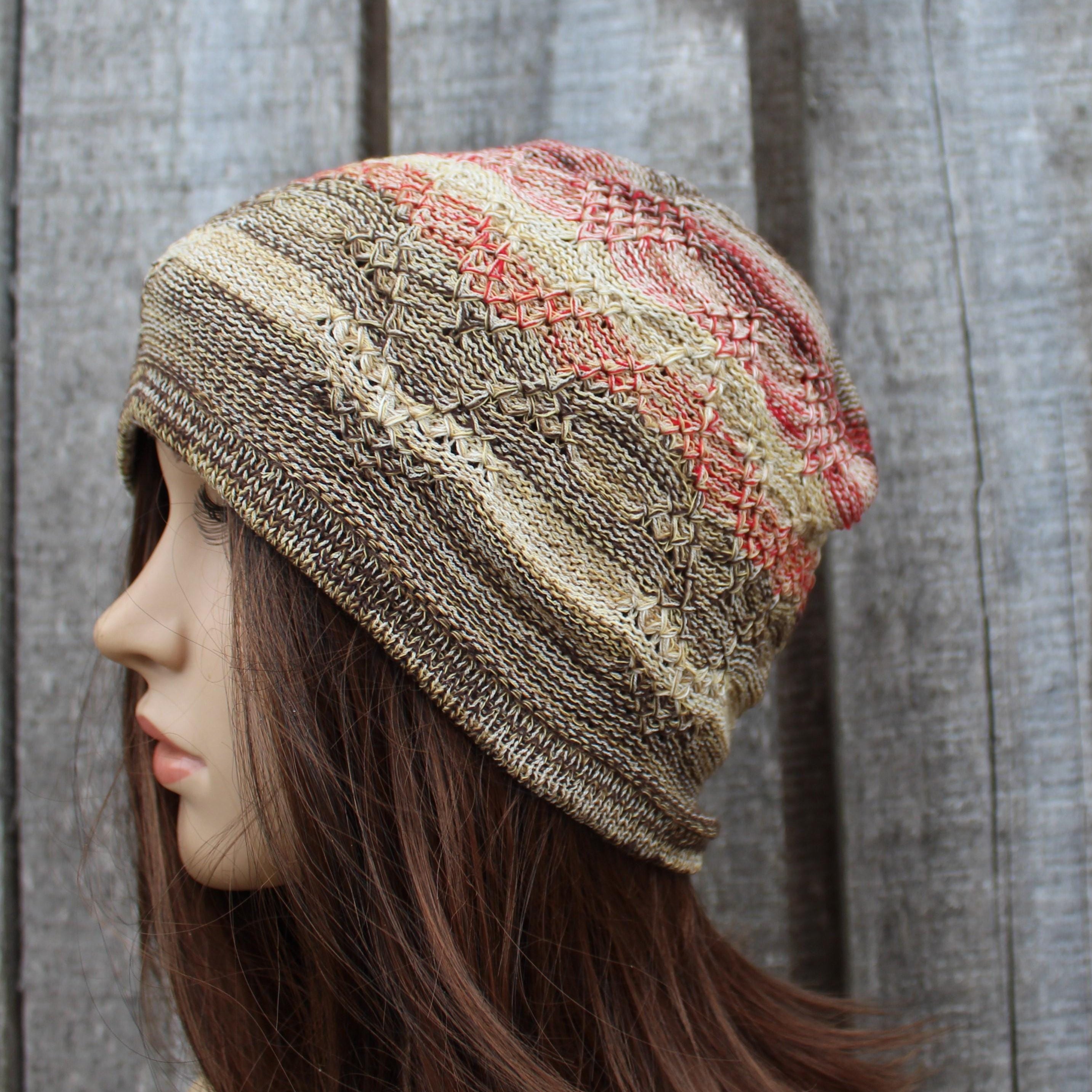 Knitted hat worn by a mannequin against a wooden background