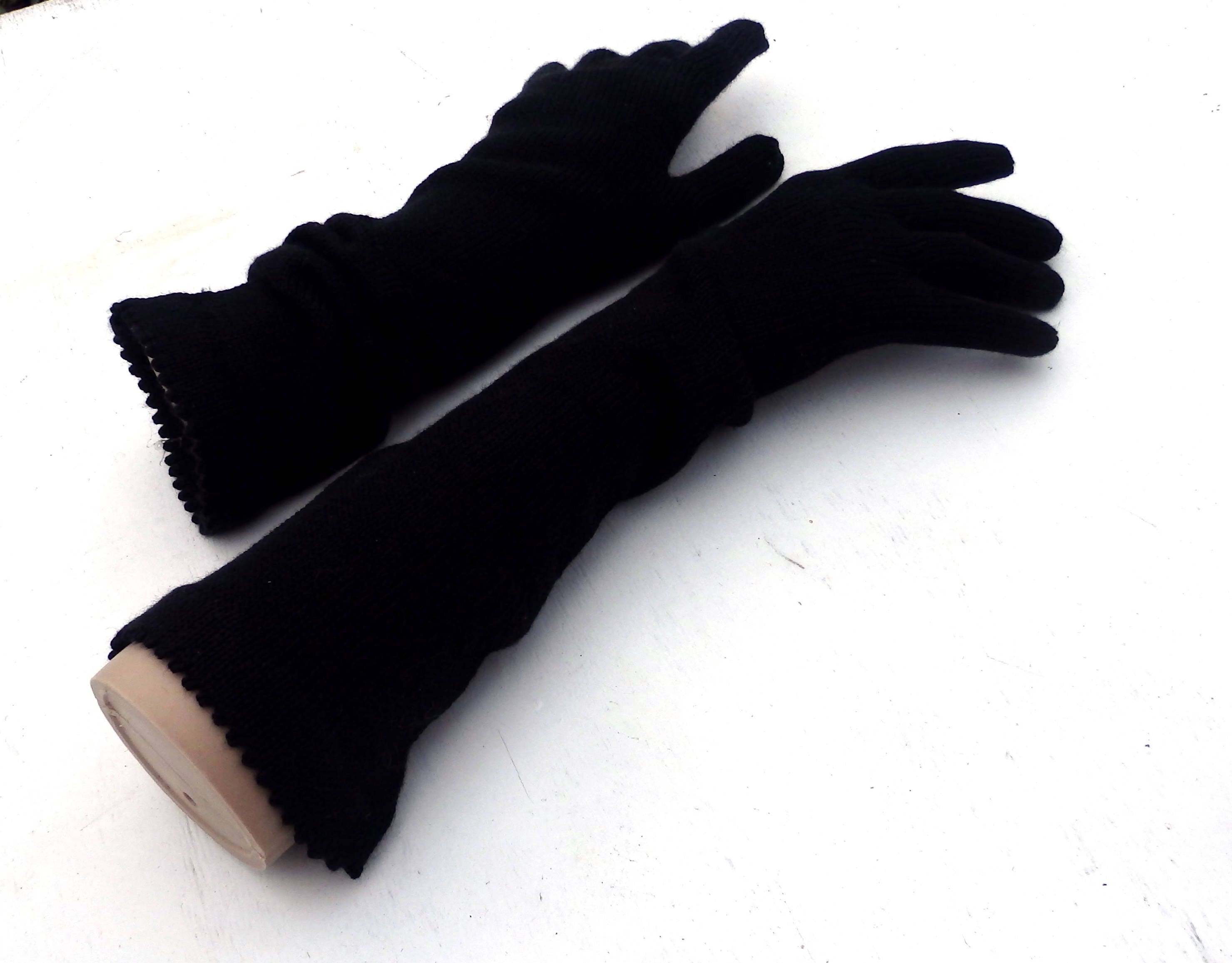 Pair of black gloves on a white background
