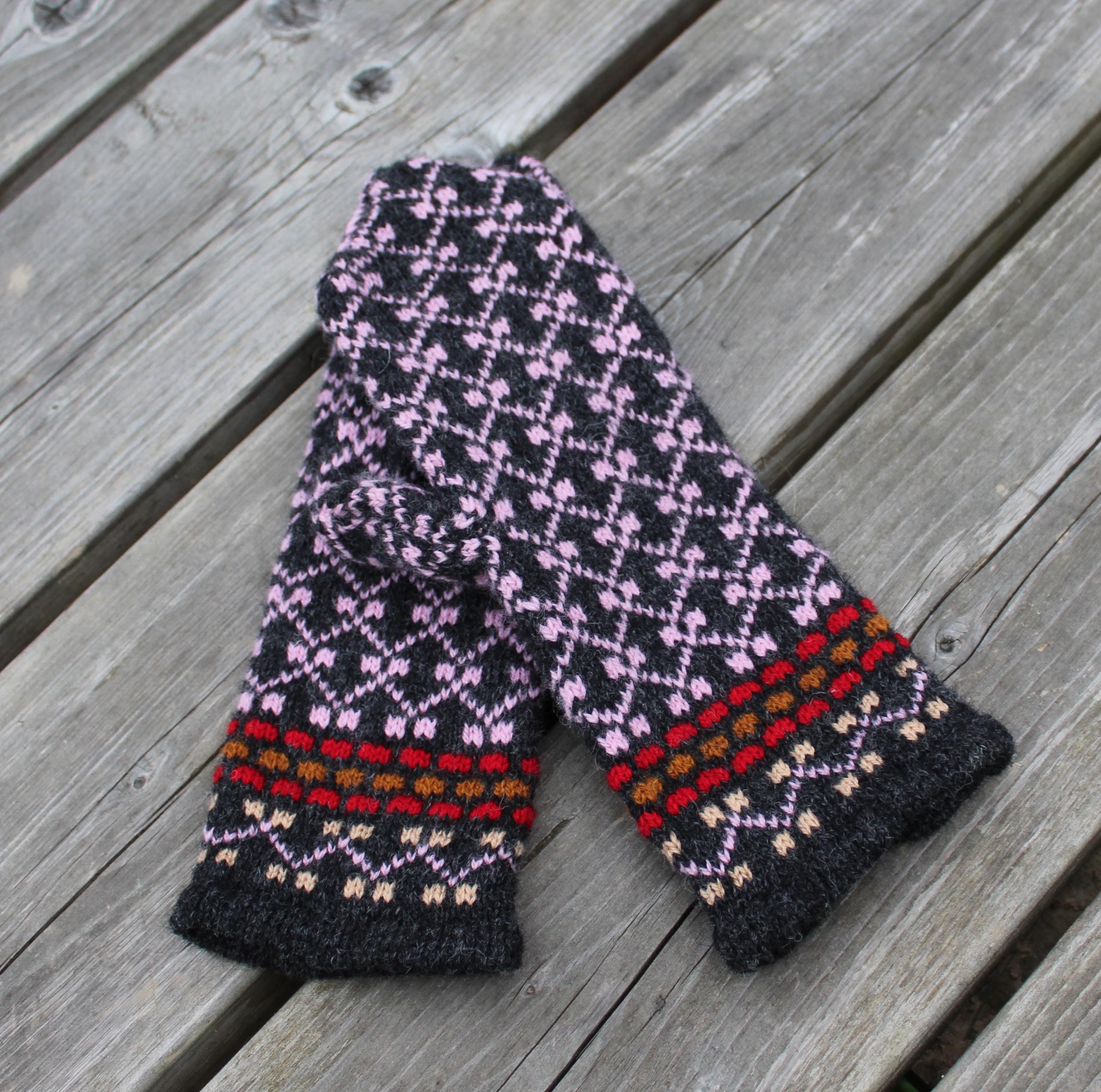 Knitted scarf with a colorful pattern on a wooden surface