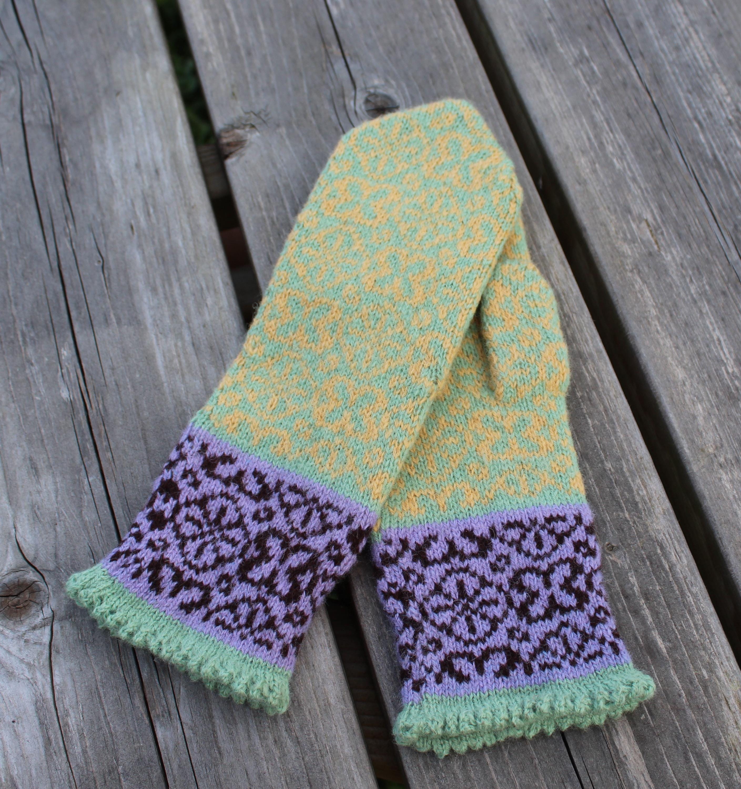 Knitted scarf with patterned ends on a wooden surface