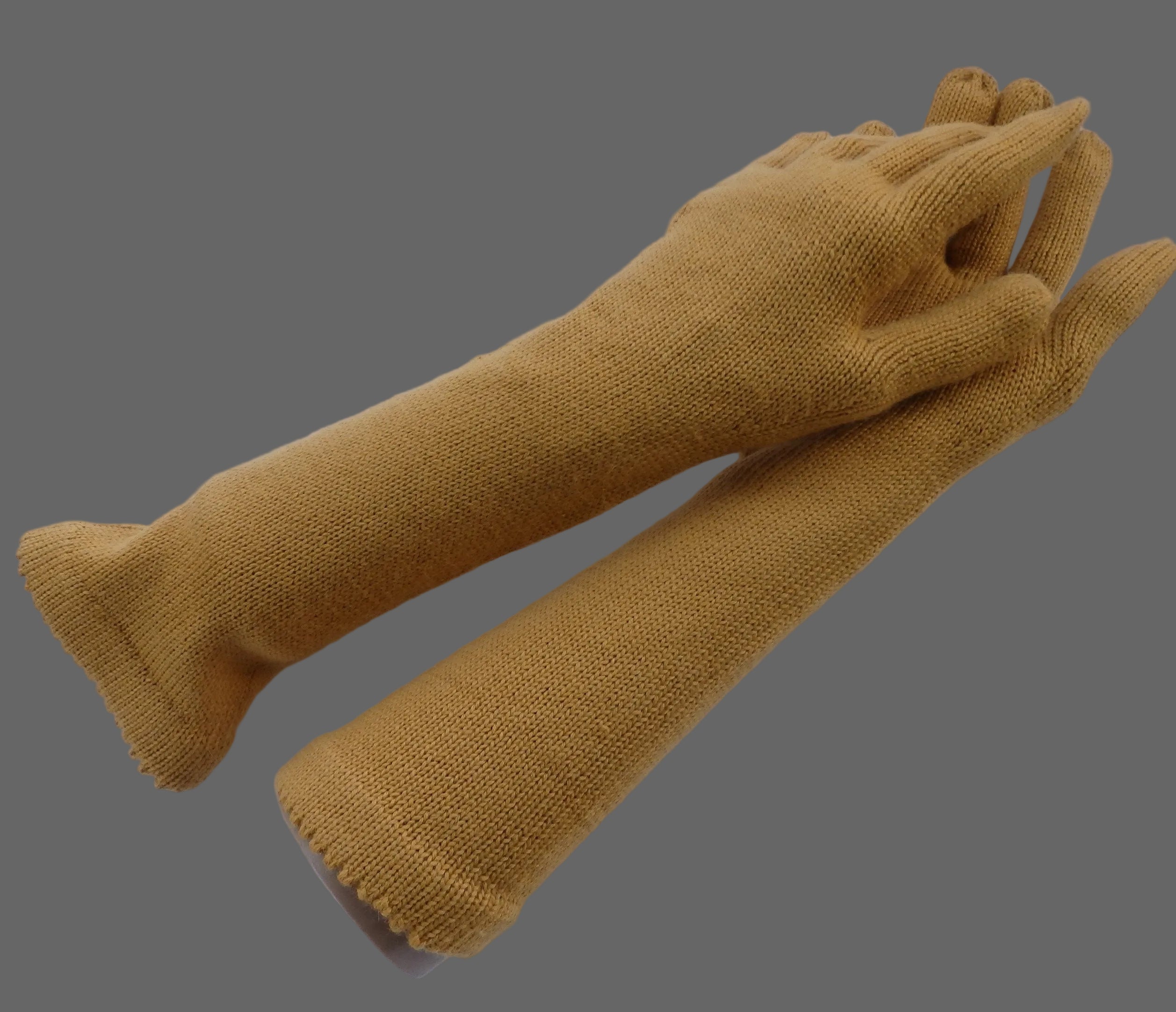 Pair of mustard yellow gloves on a white background