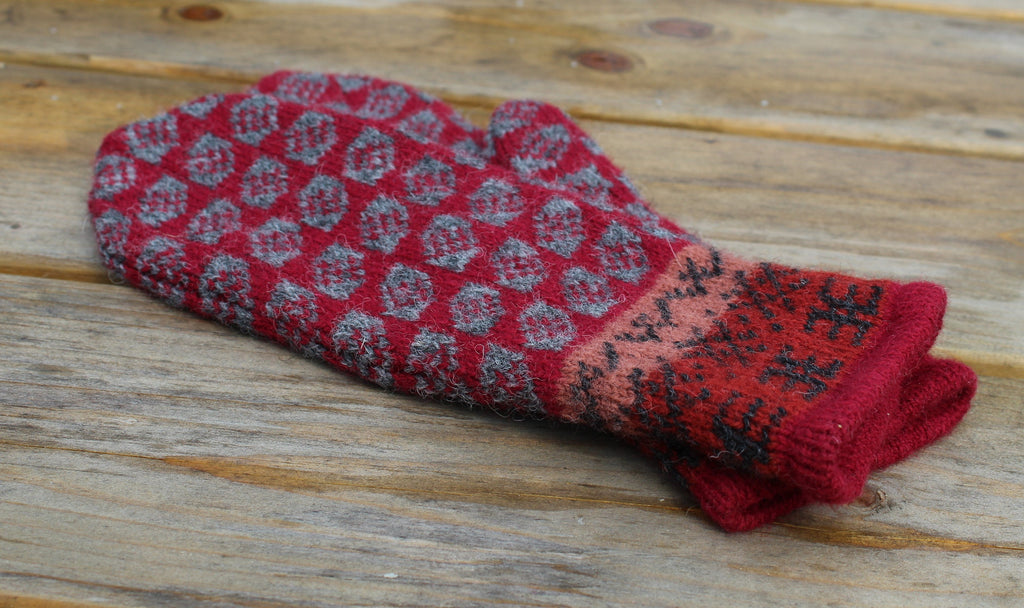 Folded red patterned sock on a wooden surface