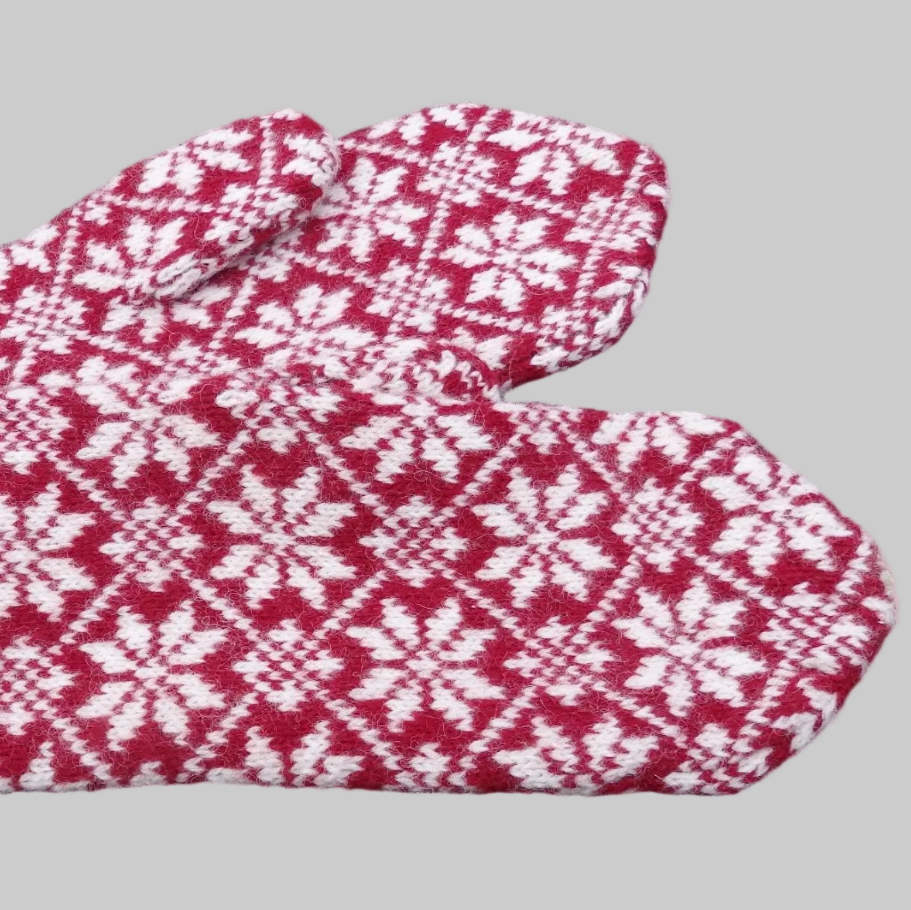 Red and white patterned mittens 
