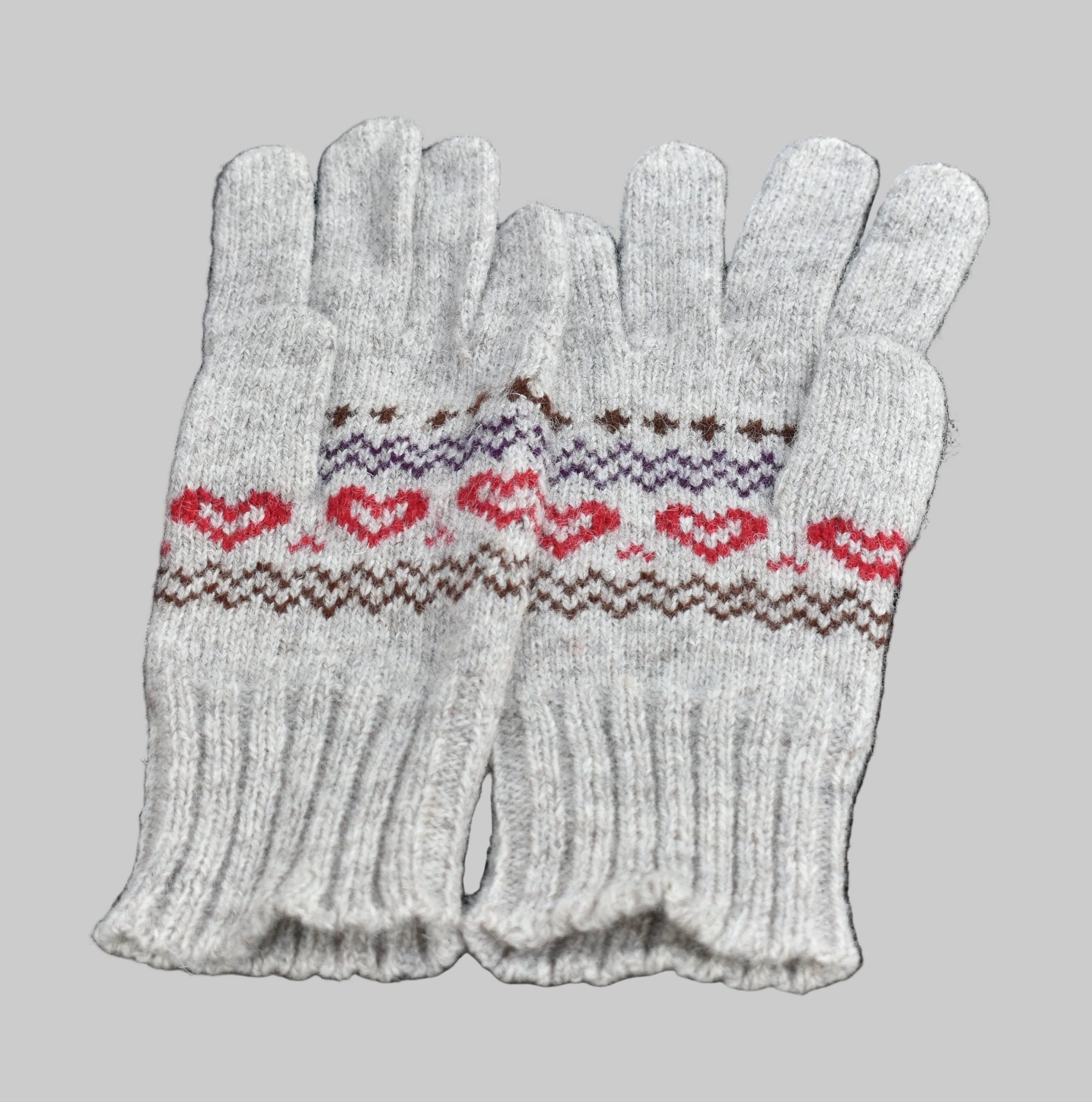 Pair of white gloves with red and brown pattern on a black background