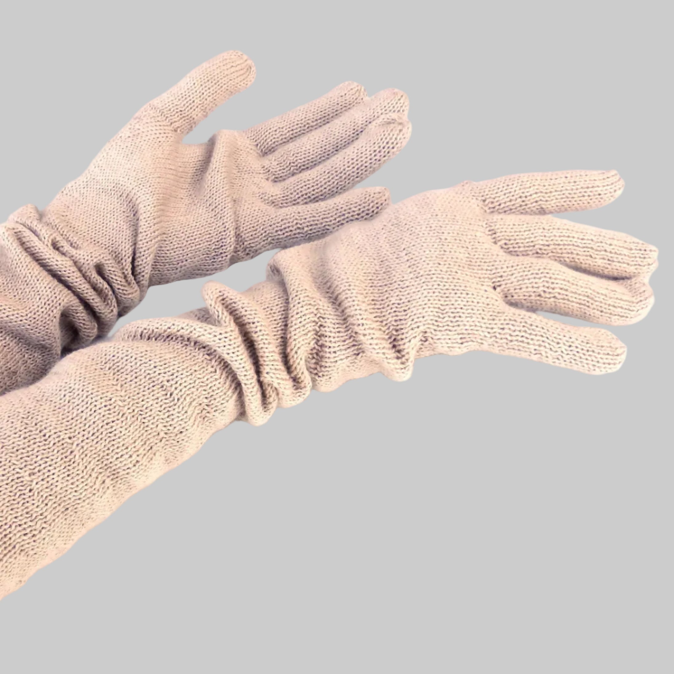 Pair of beige gloves on a white background